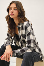 Load image into Gallery viewer, Woman wearing a black and white checkered shirt against a plain background
