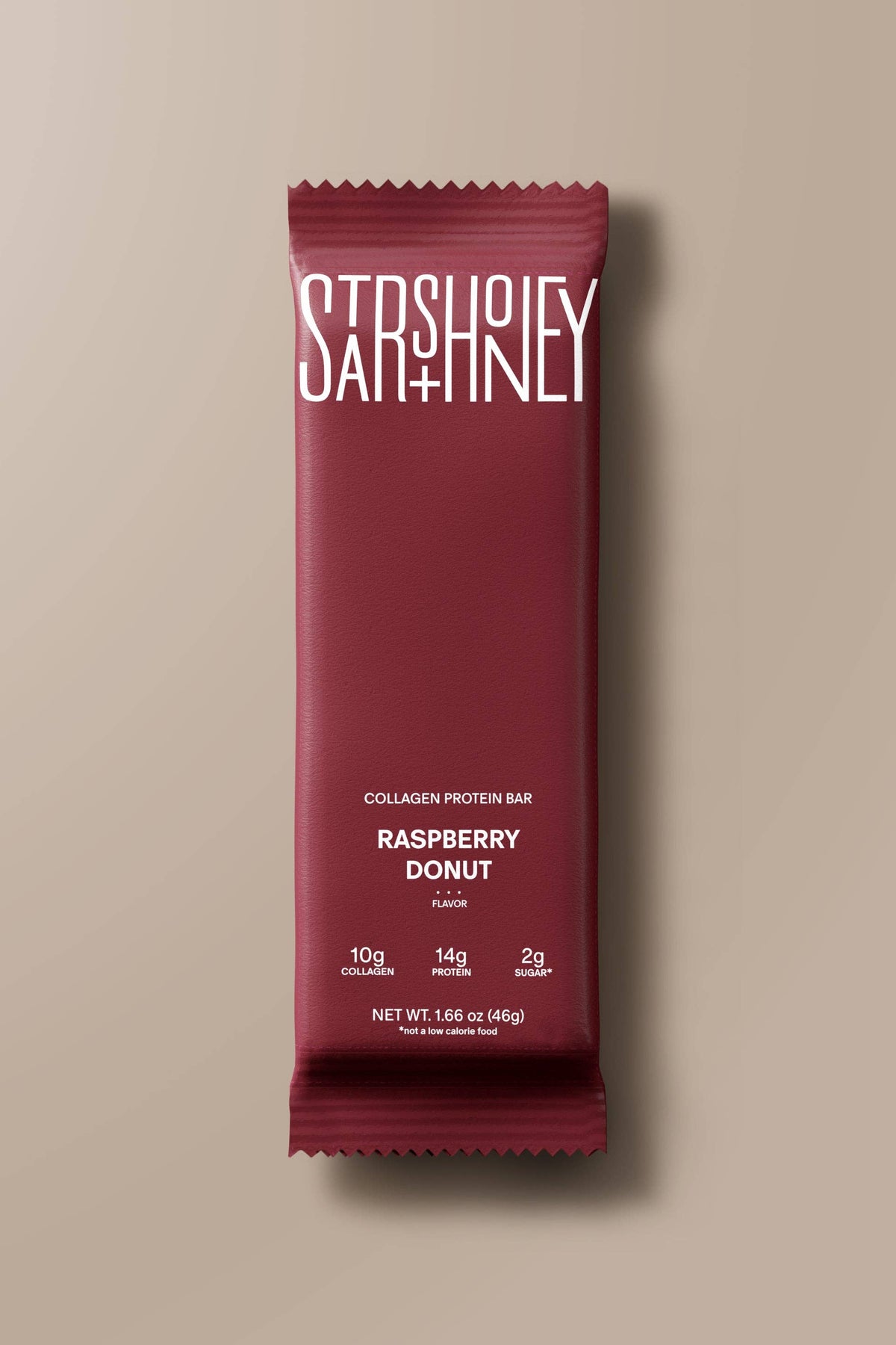 Maroon package of Stash Honey Raspberry Donut on a beige background