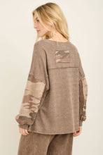 Load image into Gallery viewer, Woman wearing a long-sleeve top with camouflage sleeves on a beige background