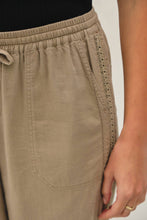 Load image into Gallery viewer, Close-up of beige pants with a plain background