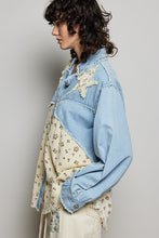 Load image into Gallery viewer, Person wearing a denim jacket over a floral shirt against a plain background