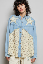 Load image into Gallery viewer, WOMAN WEARING EMBELLISHED PATCH SHIRT WITH GREY BACKGROUND