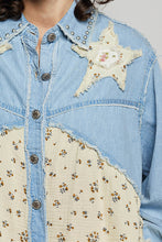 Load image into Gallery viewer, WOMAN WEARING EMBELLISHED PATCH SHIRT WITH GREY BACKGROUND
