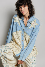 Load image into Gallery viewer, WOMAN WEARING EMBELLISHED PATCH SHIRT WITH GREY BACKGROUND