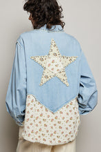 Load image into Gallery viewer, WOMAN WEARING EMBELLISHED PATCH SHIRT WITH GREY BACKGROUND