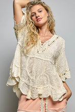 Load image into Gallery viewer, WOMAN WEARING CREAM COLOR LACE BLOUSE WITH GREY BACKGROUND