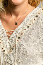 Load image into Gallery viewer, WOMAN WEARING CREAM COLOR LACE BLOUSE WITH GREY BACKGROUND