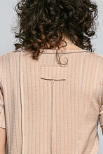 Load image into Gallery viewer, Beige textured shirt with a pocket on a plain background