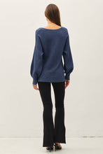 Load image into Gallery viewer, Woman wearing a blue sweater and black pants on a white background