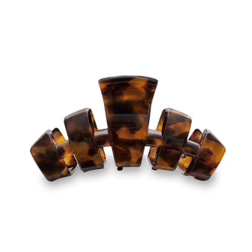 Tortoiseshell hair clip on a white background
