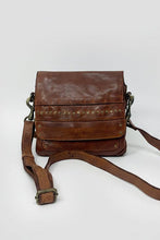 Load image into Gallery viewer, Brown leather crossbody bag on a light gray background