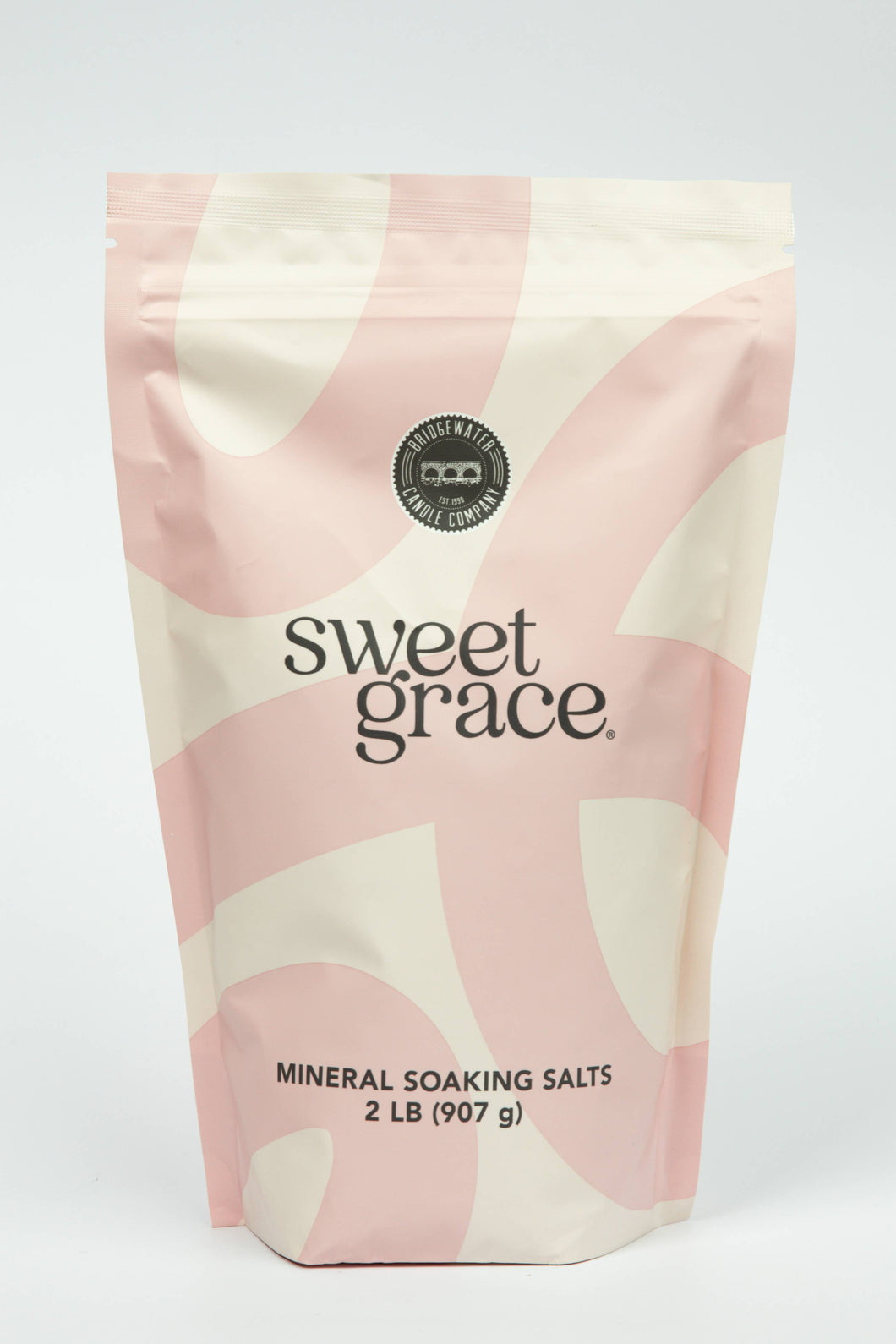 Bag of sweet grace mineral soaking salts with pink and beige design on a white background