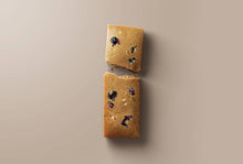 Load image into Gallery viewer, Two rectangular cookies with blueberries on a beige background