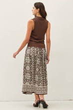 Load image into Gallery viewer, Woman wearing a brown sleeveless top and patterned skirt on a white background