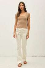 Load image into Gallery viewer, woman wearing taupe top with white background