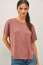 Load image into Gallery viewer, Woman wearing a pink t-shirt and blue jeans against a white background