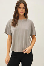 Load image into Gallery viewer, Woman wearing a gray t-shirt against a plain background