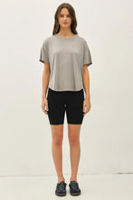 Load image into Gallery viewer, Woman wearing a gray t-shirt and black shorts on a white background