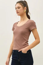 Load image into Gallery viewer, Woman wearing a brown t-shirt and dark blue jeans against a white background
