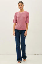 Load image into Gallery viewer, Woman wearing a pink sweater and blue jeans against a white background