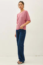 Load image into Gallery viewer, Woman wearing a pink top and blue jeans against a white background