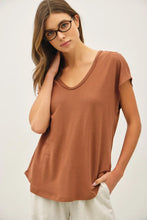 Load image into Gallery viewer, Woman wearing a brown t-shirt and glasses on a white background