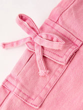 Load image into Gallery viewer, Close-up of a pink jacket with a tie detail on a light background