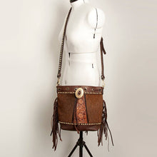 Load image into Gallery viewer, Brown leather handbag with fringe and decorative elements on a mannequin against a plain background