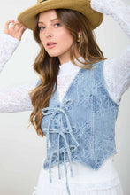 Load image into Gallery viewer, Woman wearing a light blue embroidered vest over a white lace top, with a beige hat.