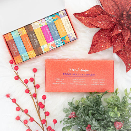 Room spray sampler box with decorative poinsettia and berries on a white surface