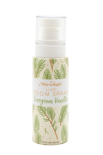 Room spray bottle with green leaf design on a white background