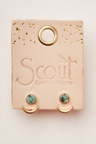 Earrings on a Scout Curated Wears card with a beige background