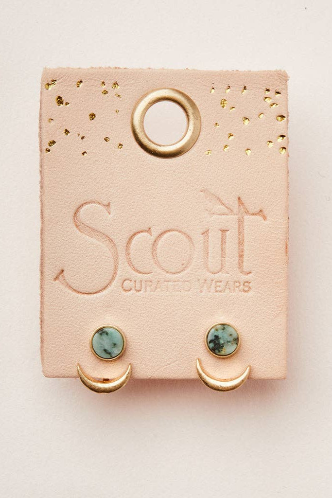 Earrings on a Scout Curated Wears card with a beige background