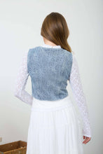 Load image into Gallery viewer, Woman wearing a blue embroidered top with white lace sleeves and a white skirt against a plain background