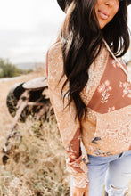 Load image into Gallery viewer, Woman wearing a floral lace top in an outdoor setting