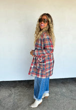 Load image into Gallery viewer, Woman wearing a plaid shirt and jeans against a white wall