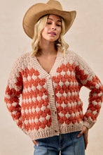 Load image into Gallery viewer, Woman wearing a patterned cardigan and cowboy hat against a beige background