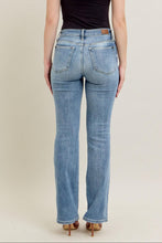 Load image into Gallery viewer, Person wearing blue jeans and a black top on a plain background