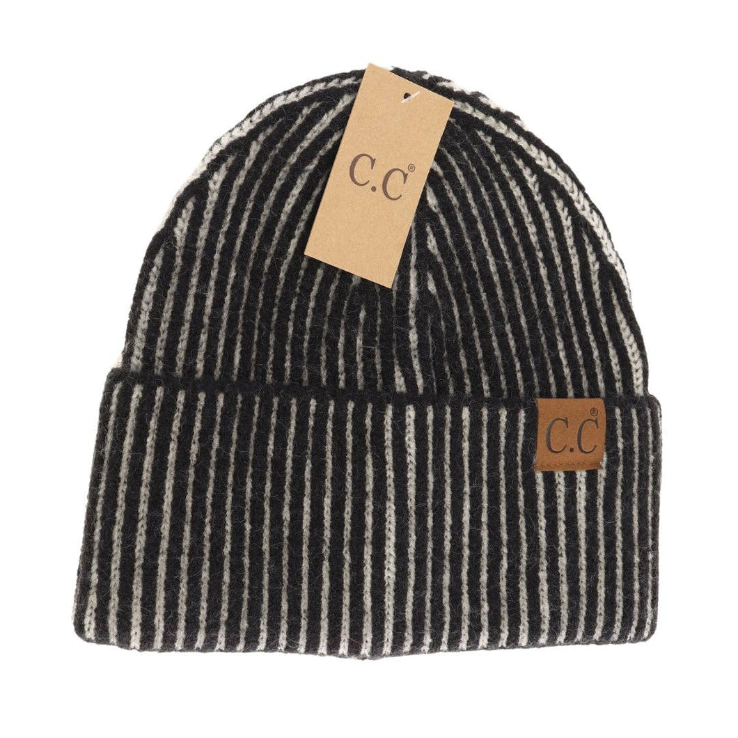 Black and white striped beanie with 'C.C' label on a white background
