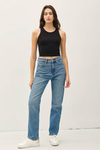 Load image into Gallery viewer, Woman wearing a black tank top and blue jeans against a white background