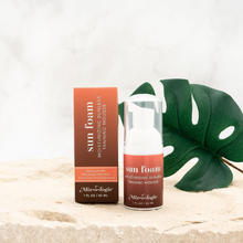 Load image into Gallery viewer, Sun foam product with packaging and a green leaf on a neutral background