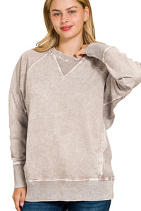 woman wearing beige sweatshirt