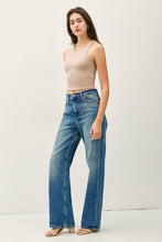 Load image into Gallery viewer, Woman wearing a beige tank top and blue jeans on a white background