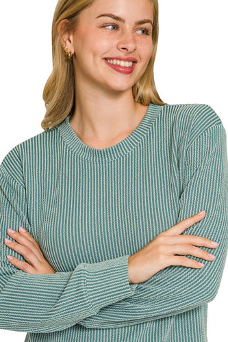 woman wearing teal top