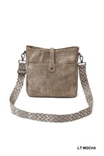 Load image into Gallery viewer, Light brown leather crossbody bag with a patterned strap on a white background