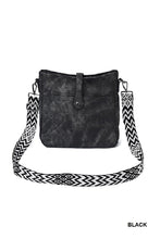 Load image into Gallery viewer, Black handbag with a patterned strap on a white background