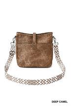 Load image into Gallery viewer, Brown leather handbag with a patterned strap on a white background