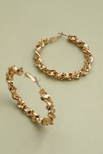 Load image into Gallery viewer, Gold chain hoop earrings on a light green background