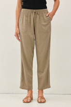 Load image into Gallery viewer, Person wearing beige pants with a white background