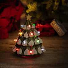 Load image into Gallery viewer, Decorative Christmas tree light on a wooden surface with festive background